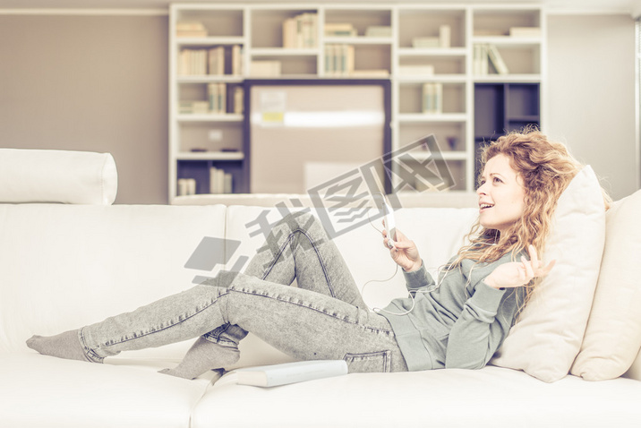 Woman listens music at home