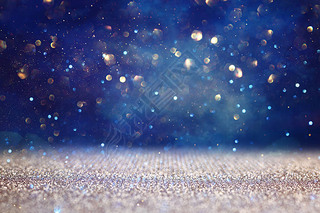 abstract glitter black, gold and blue lights background. de-focused