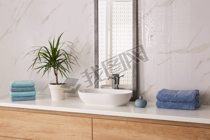 Modern mirror and vessel sink in stylish bathroom