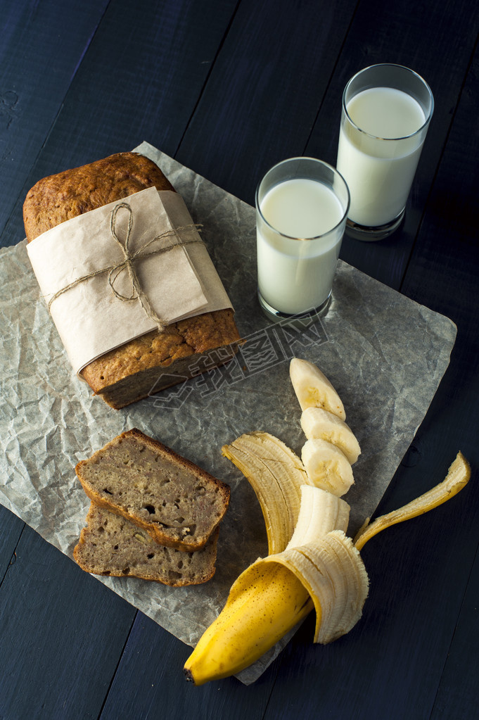 Banana bread slices with glasses of milk