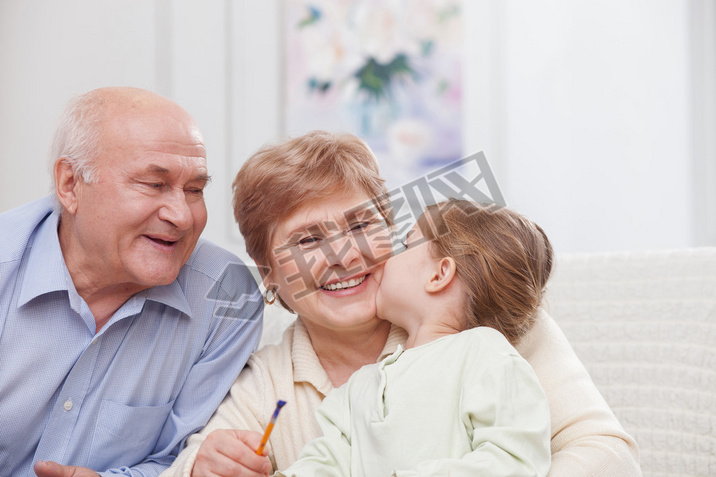 Pretty grandparents are taking care of child