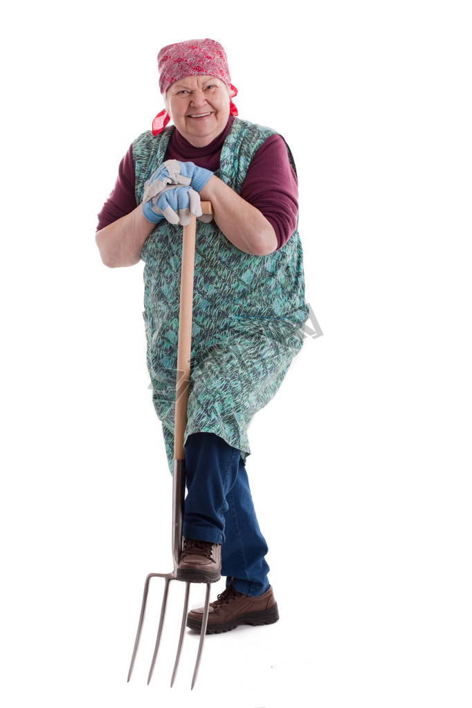 Active elderly woman holding pitchfork 3