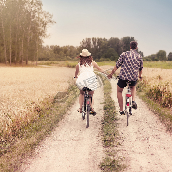 Romantic couple cycling together