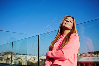 Dreamy woman enjoying at beautiful sunny day