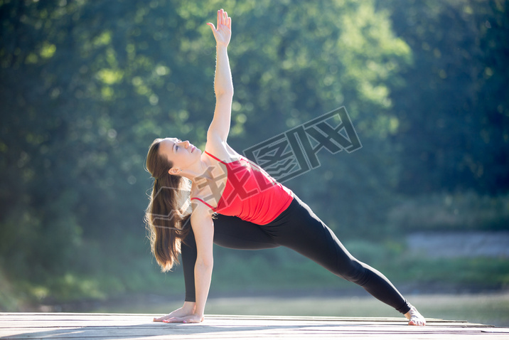 Teenage girl in Extended Side Angle Pose