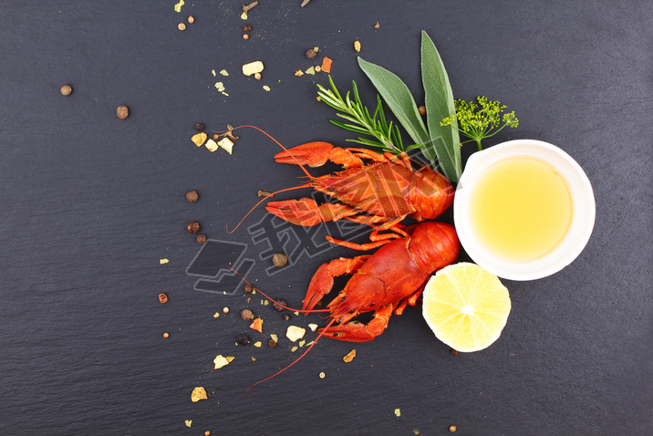 Delicious fresh lobster on dark vintage background. Seafood with aromatic herbs, spices and vegetabl