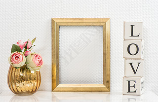 Mock up with golden frame and flowers. Love concept