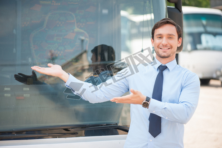 Cheerful young man is advertising a public transport