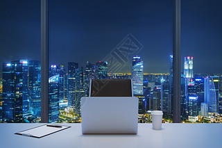 A workplace in a modern panoramic office with New York evening view. A white table, black leather ch