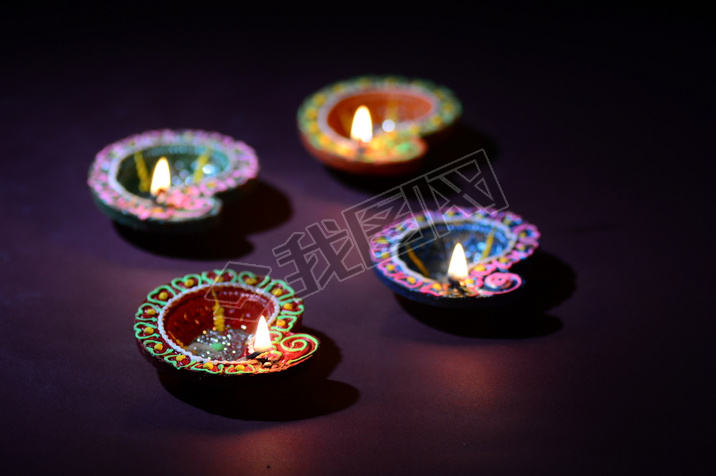 Colorful clay Diya (Lantern) lamps lit during Diwali celebration. Greetings Card Design Indian Hindu