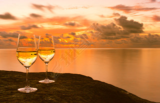 Wineglasses with ocean background