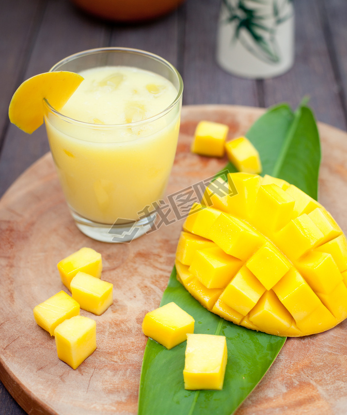 Mango juice, oothie ,mango fruit on a wooden background