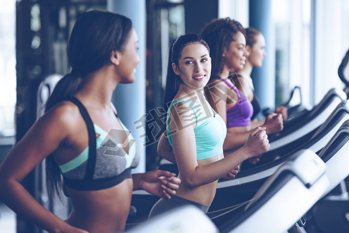 young beautiful women  running on treadmill 