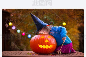 Kids carving pumpkin at Halloween