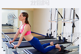 Pilates reformer woman down stretch exercise