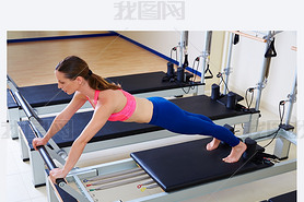 Pilates reformer woman long stretch exercise