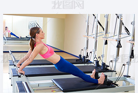 Pilates reformer woman long back stretch exercise