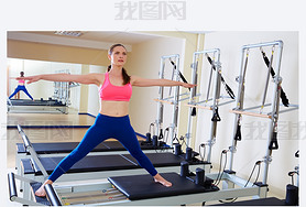 Pilates reformer woman side split exercise