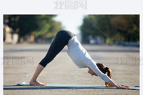 Street yoga: Downward facing dog pose