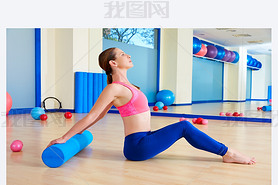 Pilates woman roller exercise workout at gym