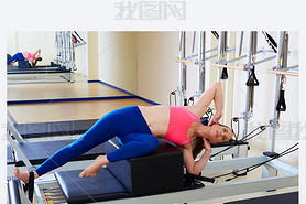 Pilates reformer woman short box side stretch