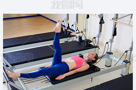 Pilates reformer woman foot work exercise