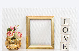 Mock up with golden frame and flowers. Love concept