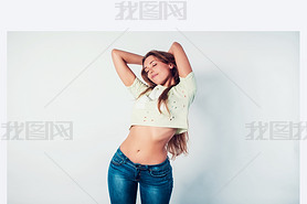 happy young woman model standing playful in casual style