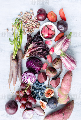 Assorted purple toned fruits and vegetables