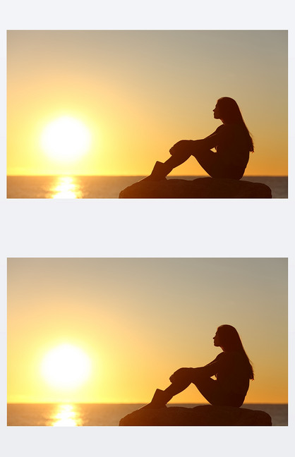 看着太阳,在日落的女人剪影