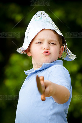 Child playing pirate outdoors in homemade costume