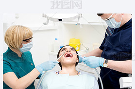 Dental cleaning, woman under treatment.