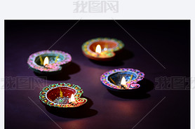 Colorful clay Diya (Lantern) lamps lit during Diwali celebration. Greetings Card Design Indian Hindu