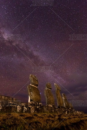 Moais in Ahu Vai Uri, Tahai Archaeological Complex, Rapa Nui National Park, Easter Island in the nig