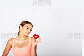 Heart shape in womans hands.