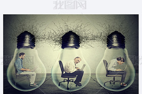 Company employees sitting in row inside electric lamp light bulb using laptop 