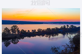 Amazing orange dawn on blue lake