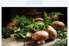 Royal brown mushrooms with a sprig of parsley and dill 