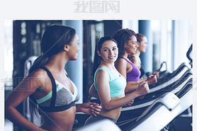 young beautiful women  running on treadmill 