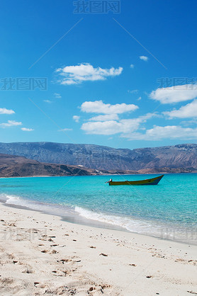 Socotra, Yemen, Middle East: the breathtaking landscape with a boat on the beach of Ras Shuab, Shuab