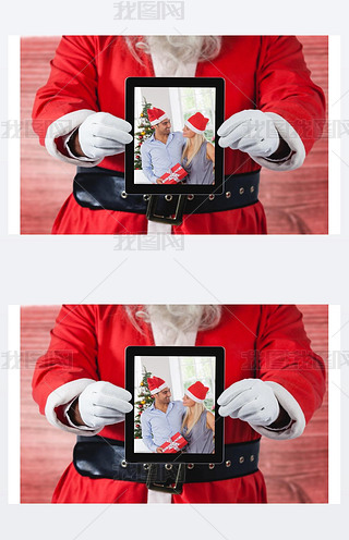 圣诞老人手里拿着一个数字平板电脑，上面有一对圣诞夫妇的照片