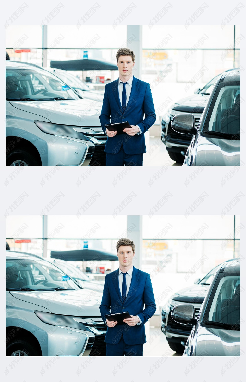 manager standing between cars in showroom