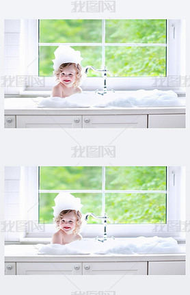 Baby girl taking bath with foam