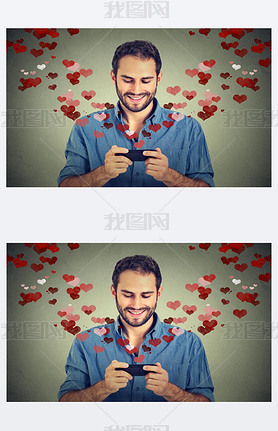 man sending love s message on mobile phone with hearts flying away
