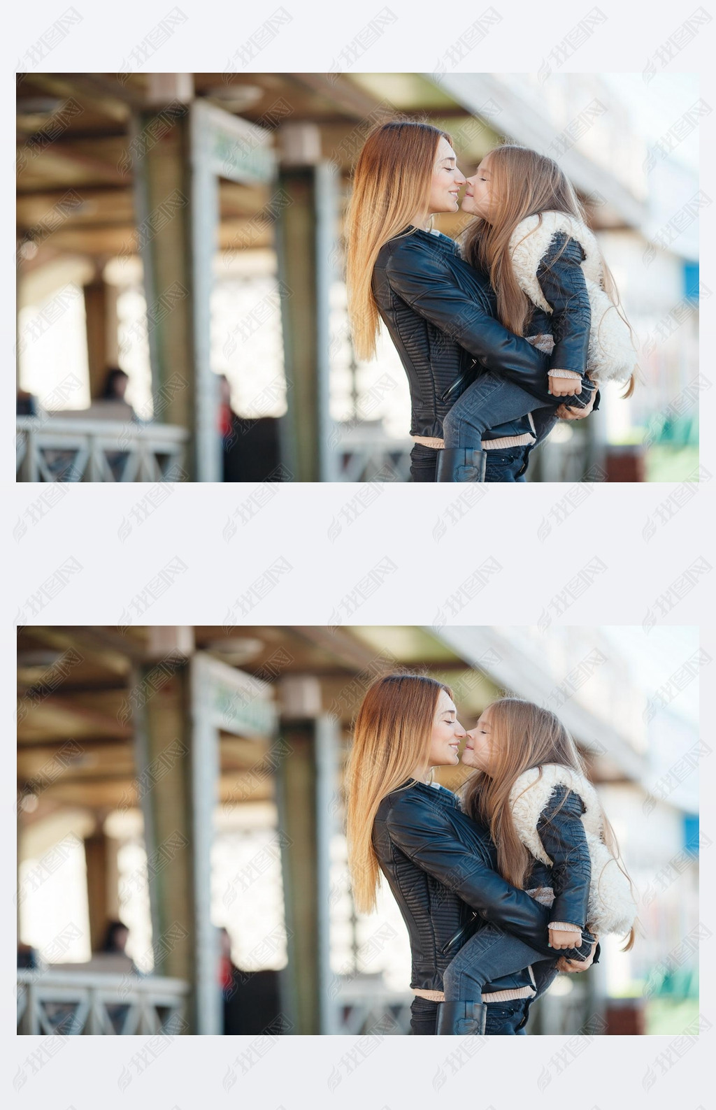 Mother holding daughter in her arms,standing in the fresh air