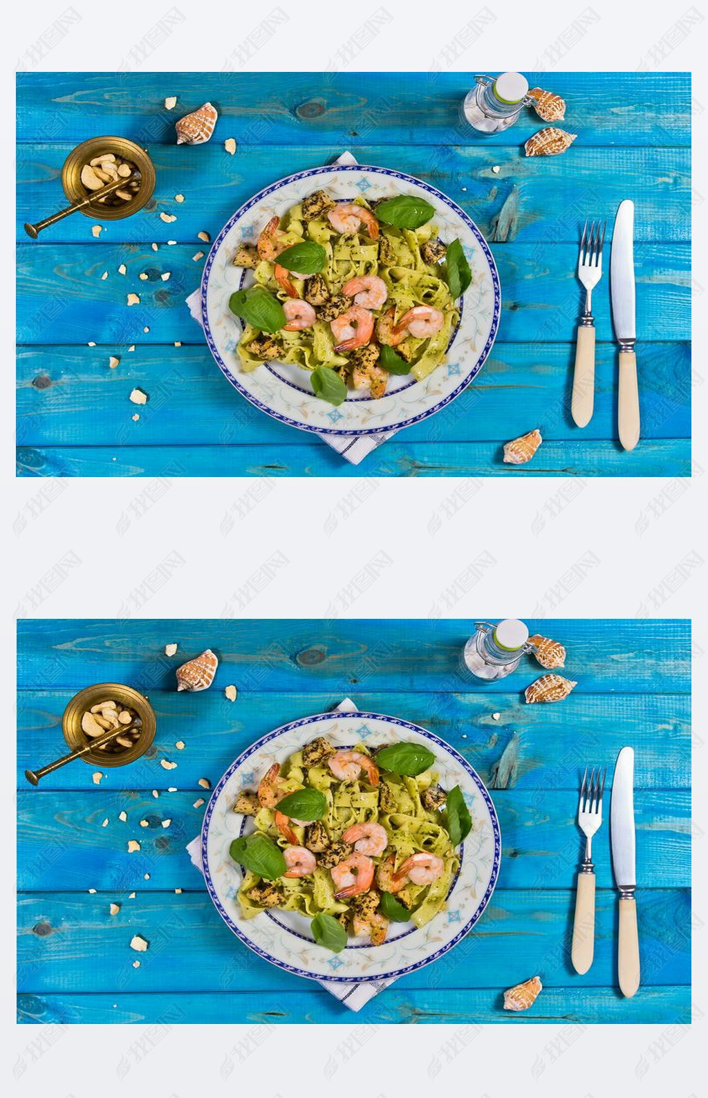 Tagliatelle pasta with shrimps, nuts and chicken on wooden table