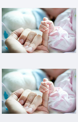 妈妈的手抱着婴儿.照片摄于新生儿妇科