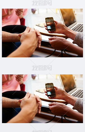 Closeup image of two person are watching video in internet via cellphone, while they are sitting in 