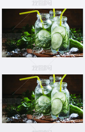 Refreshing cold drink of cucumber and herbs in glass bottles