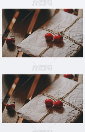 fresh cherries on plate with wrapped gift on wooden table. Vintage toned, farm life concept. Selecti